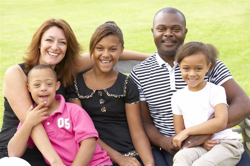 Family with 2 daughters and son with Down Syndrome
